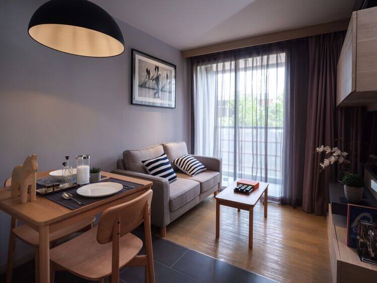 VOQUE Hotel & Serviced Residence har koselig liten stue